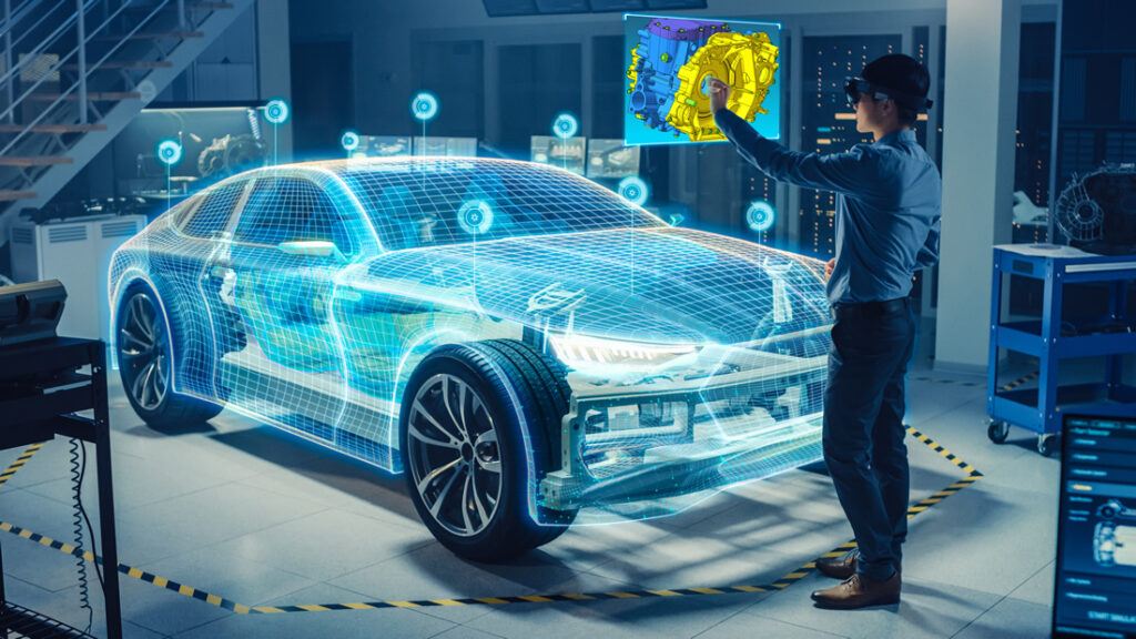 Eine Person an einem holographischen Display bearbeitet per Fingerzeig CAD-Daten, im Hintergrund das 3D-Modell eines Autos in Originalgröße